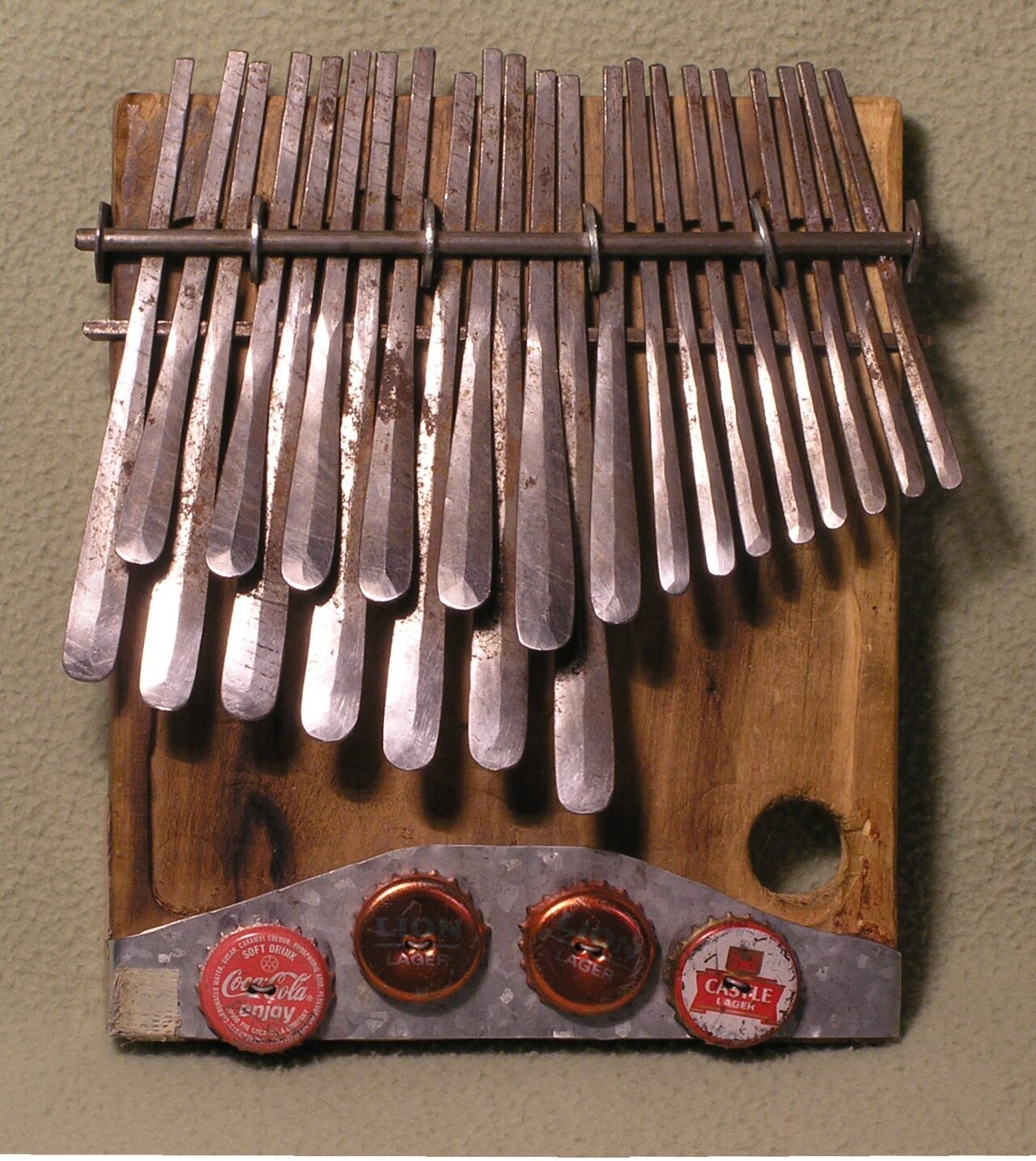 Handcrafted mbira dzavadzimu with bottle cap buzzers